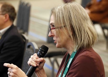 Photo: Amy Heintz asking a question during a presentation at the battelle conference on innovations in climate resilience