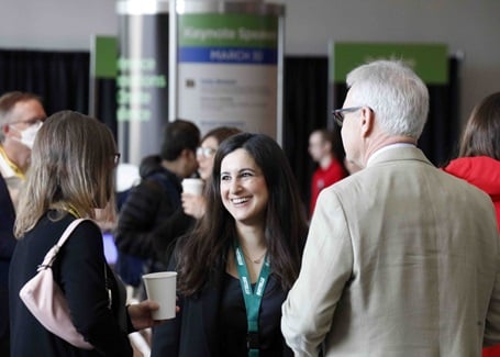 Photo: conference attendees conversing during a session break at the battelle conference on innovations in climate resilience