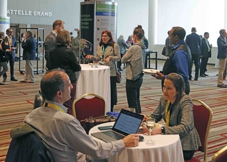 Photo: conference attendees talking during a session break at the battelle conference on innovations in climate resilience