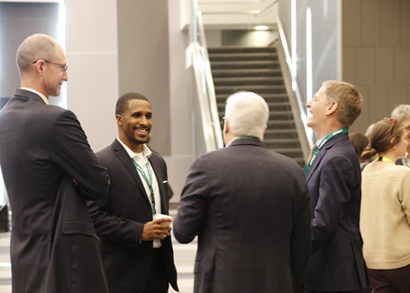 Photo: Matt Vaughan, Chandler Bridges, Lou Von Thaer and John Razzolini conversing at the battelle conference on innovations in climate resilience