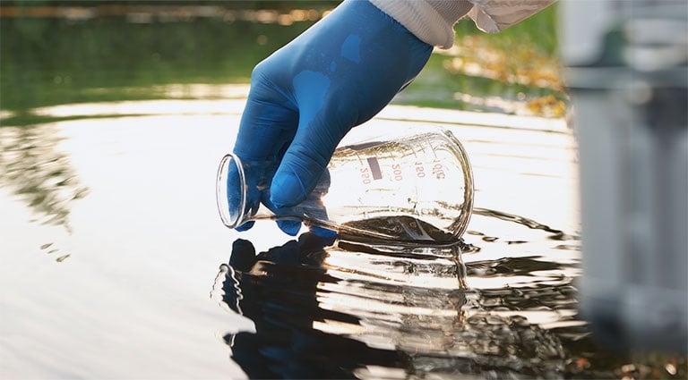 Image: Battelle PFAS expert sampling at a PFAS-contaminated wastewater site