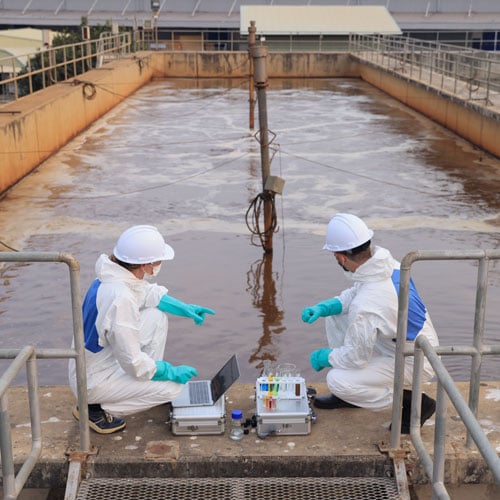 Image: Battelle PFAS expert working with a waste management professional at a wastewater treatment facility